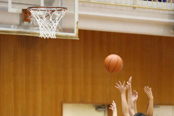 istock Students playing basketball 2162350750