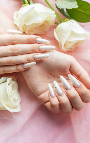 istock Female Hands with beautiful pearl manicure 2162355074