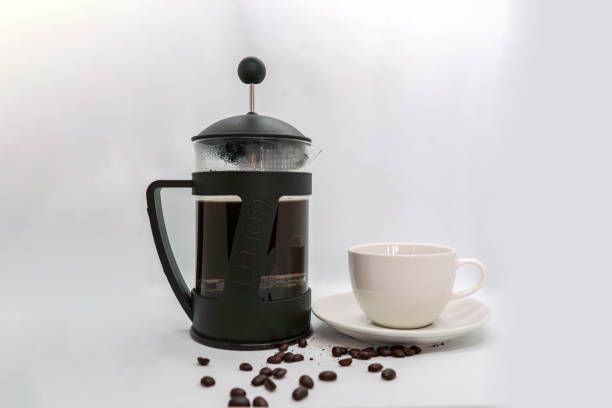 istock Brewing a Coffee in a French Press Plunger Black Coffee Beans Isolated White Background 2162357621