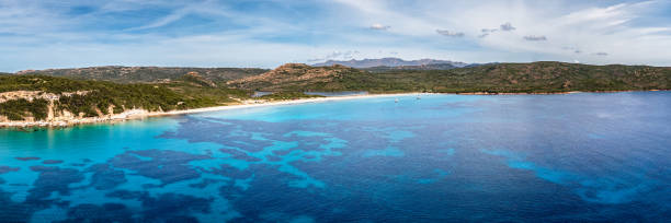 Panoramic aerial view of the Plage de Balistra and the translucent turquoise Mediterranean sea on the south east coast of the island of Corsica