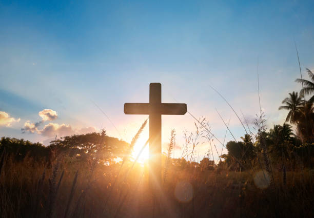 istock Silhouette of catholic cross at sunset background. 2162360788