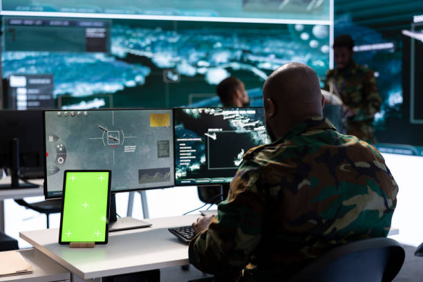 istock Military man works in command post working on collecting real time data 2162363453