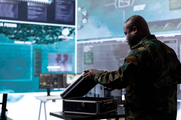 istock Army espionage specialist in a control center collecting satellite cctv data 2162363503