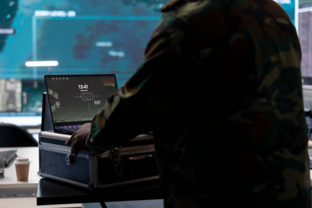 istock Military specialist monitors satellite data real time information on laptop 2162363607