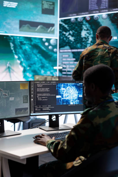 istock Military experts in a mission control center use modern technology on computer 2162363669