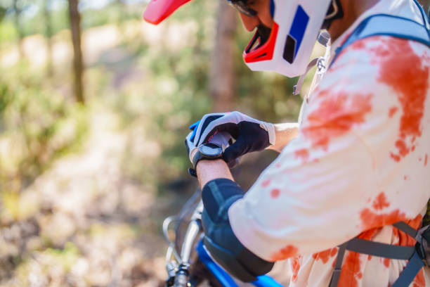 A focused Caucasian female motocross rider grips the gas handlebar with gloved hands. Her determination and skill are evident, emphasizing the intense and thrilling nature of the sport.