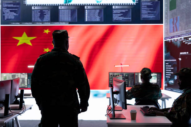 istock Military officer in uniform monitors critical data on big screen 2162364676