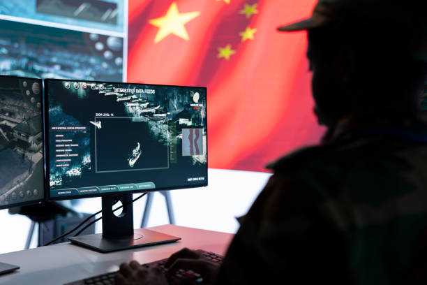 istock Military officer in uniform monitors critical data on big screen 2162364689