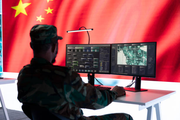 istock Military officer in uniform monitors critical data on big screen 2162364707