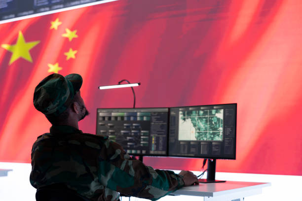 istock Military officer in uniform monitors critical data on big screen 2162364714