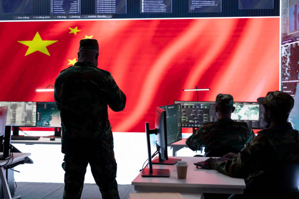 istock Military officer in uniform monitors critical data on big screen 2162364725