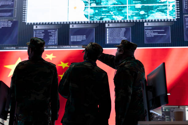istock Military intelligence officers analyze surveillance on big screen 2162364772