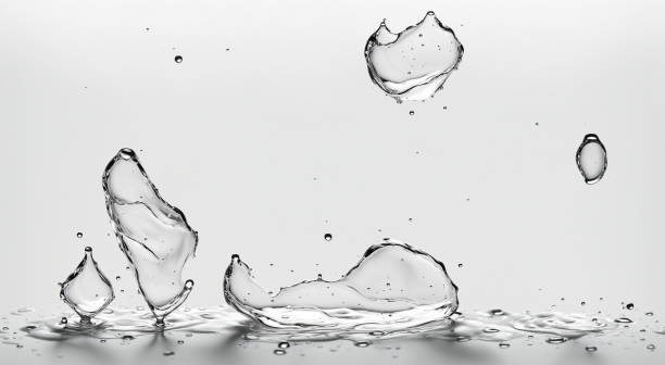 istock Water droplets frozen in mid-air, splash patterns against white background, intricate patterns and textures of water in motion. 3d render 2162364858