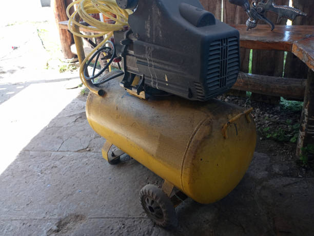 istock Yellow dirty compressor. A tool for working with high air pressure. 2162365426