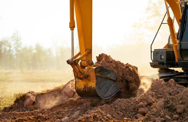 istock Backhoe working by digging soil at construction site. Crawler excavator digging on demolition site. Excavating machine. Earth moving machine. Excavation vehicle. Construction business. 2162365872