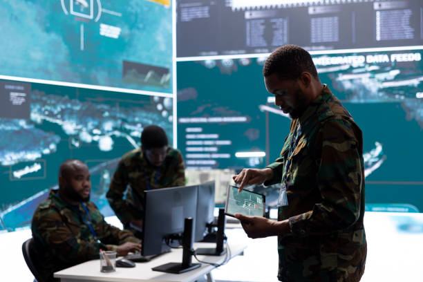 istock Military team in a control center uses advanced technology to gather information 2162366167