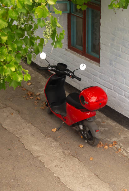 istock A red scooter under a grape arch in the yard 2162366175