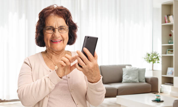istock Elderly woman using a phone at home 2162366281