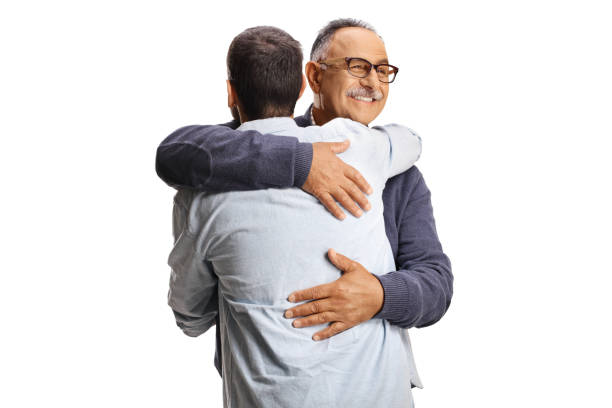 istock Mature man and younger man in embrace 2162366295