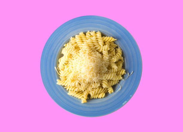 istock Pasta with Grated Cheese on Blue Plate 2162366540