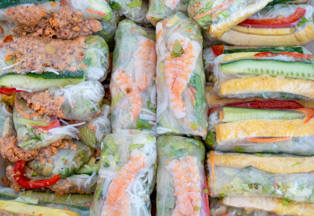 istock Spring rolls, Vietnamese summer rice rolls filled with shrimp, vegetables, herbs, and noodles 2162366658