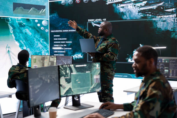 istock Group of soldiers in a secure office environment collaborates on intelligence analysis 2162366795