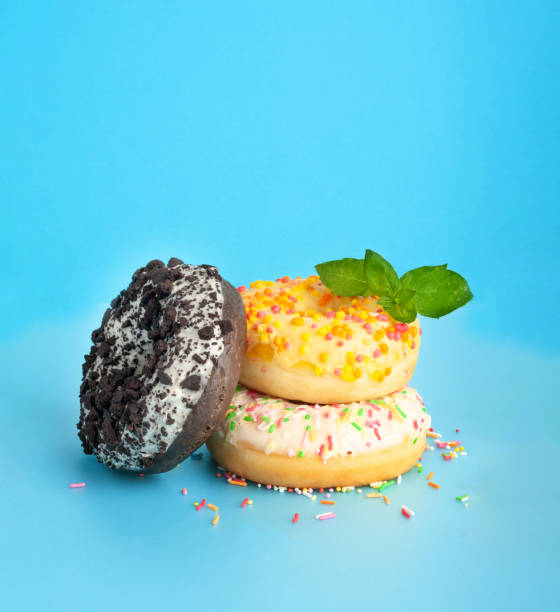 istock Doughnuts, Chocolate Brown and Pink Donut with Multicolored Sprinkles 2162366945