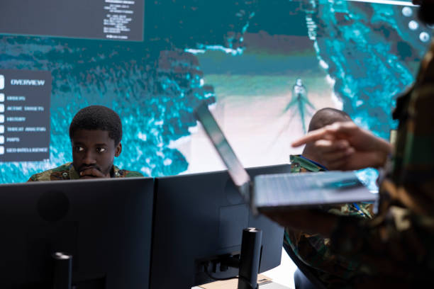 istock High tech military office with soldiers analyzing real time strategic data 2162367277