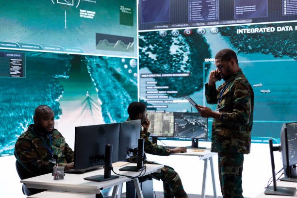 istock Military team in a command center uses advanced technology on big screen 2162367342