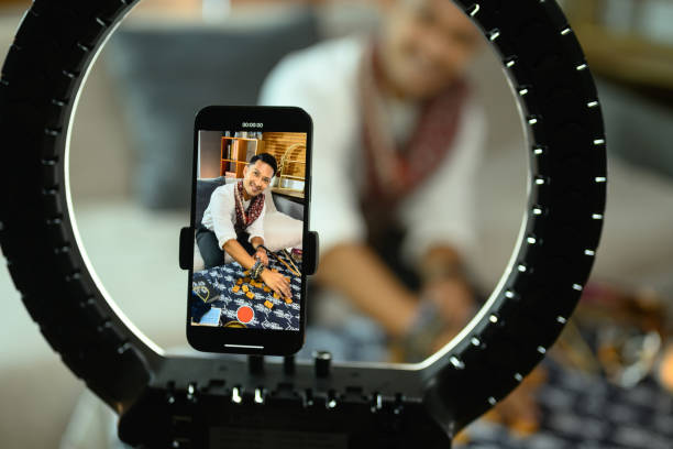 istock Cheerful man tarot reader doing predicting online and recording video with smartphone 2162368464