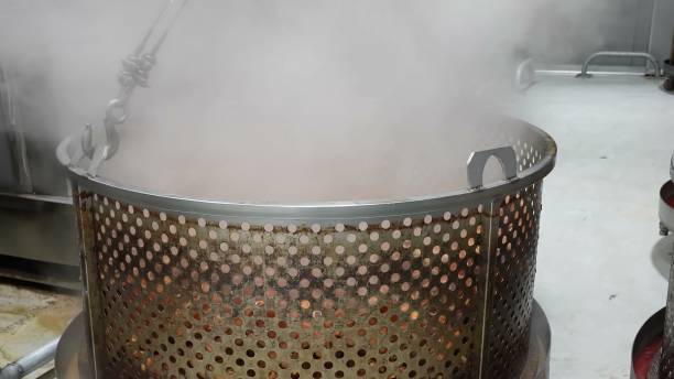 istock Boiled pork legs lifted from simmering broth 2162371196