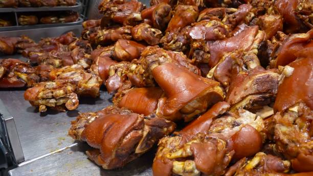 istock Cooked pork legs displayed in a stainless steel tray 2162371248