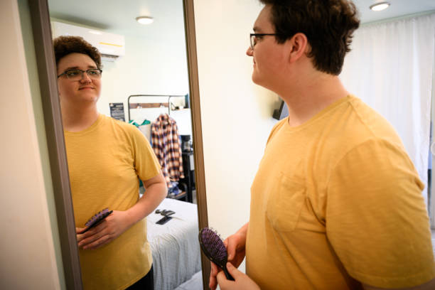 istock Confident Gen Z male student looking in mirror getting ready for the day 2162371406