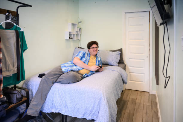 istock Gen Z male relaxing on bed playing video games 2162371542