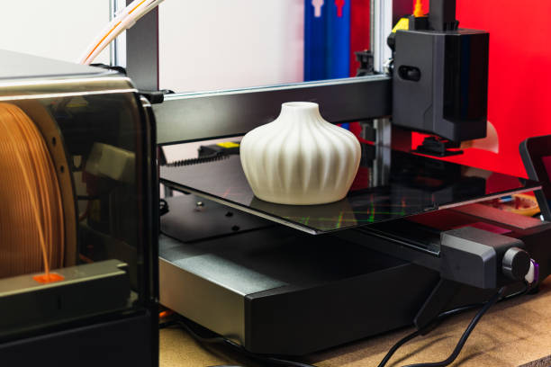 istock Four heads 3d printer, four extruders with an object on the tray, pla filament 2162371564