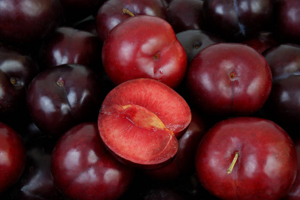 istock Ripe purple plums background 2162371741