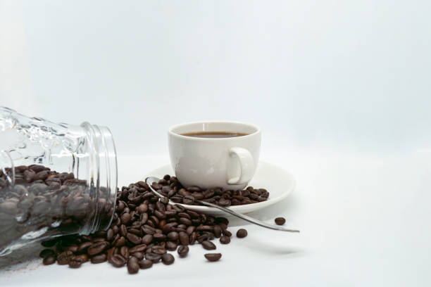 istock Espresso Americano in a ceramic fancy cup with fresh coffee bean scattered Isolated White Background 2162374308