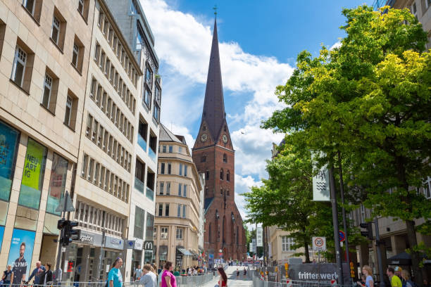 The Speicherstadt in Hamburg, is the largest warehouse district in the world where the buildings stand on timber-pile foundations. The image shows several of those beautiful buildings during a sunny day in spring season.