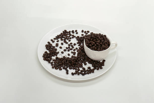 Espresso Americano in a ceramic fancy cup with fresh coffee bean scattered Isolated White Background