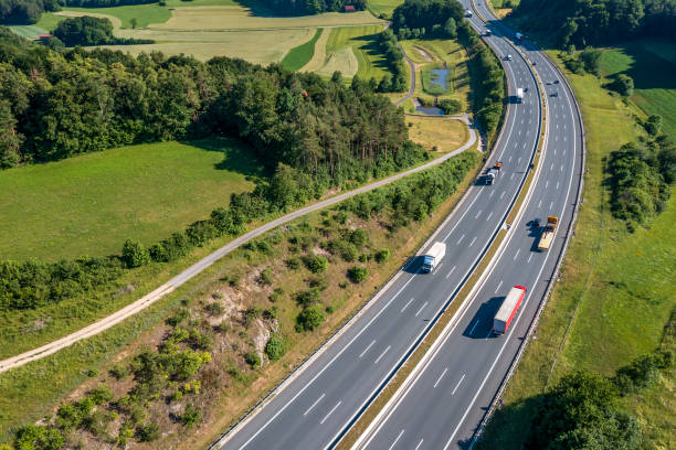 istock Trucks on a rural highway 2162379108