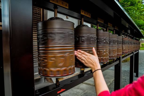 istock A person is touching a row of bells 2162380268