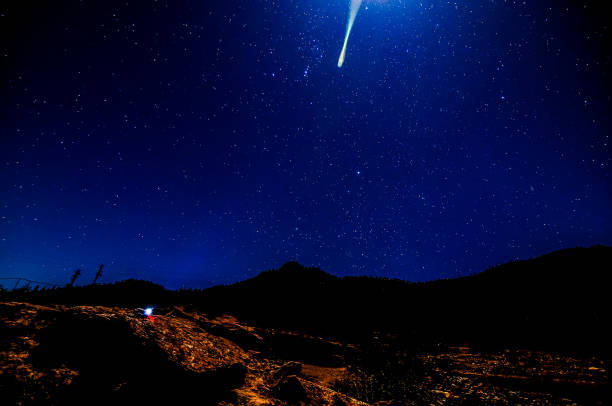 istock A bright shooting star is streaking across the night sky 2162380339