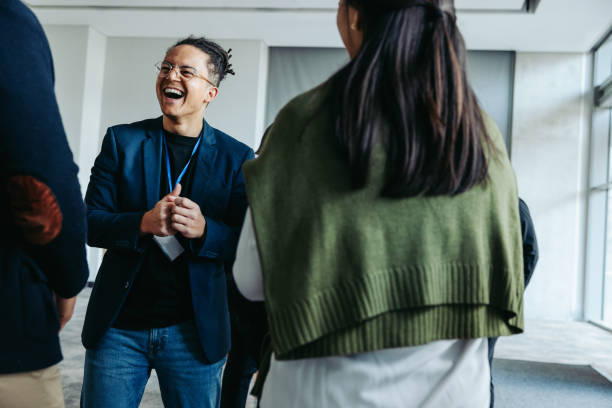 istock Businessman laughing during team-building workshop at workplace conference 2162383216