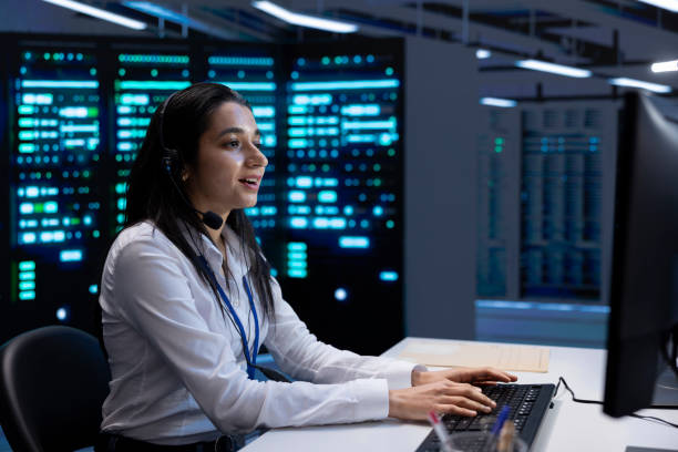 istock Smiling engineer in data center providing support for companies 2162386600