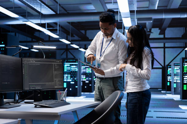 istock Team of engineers in data center looking for firewall misconfigurations 2162386798