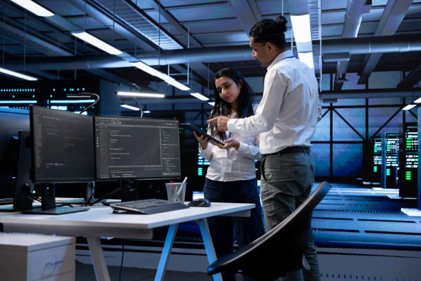 istock IT staff members fixing slow data transfer rates in data center 2162386853