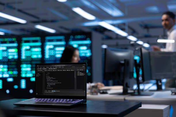 istock Focus on laptop used by IT developer in server room to find network issues 2162387047