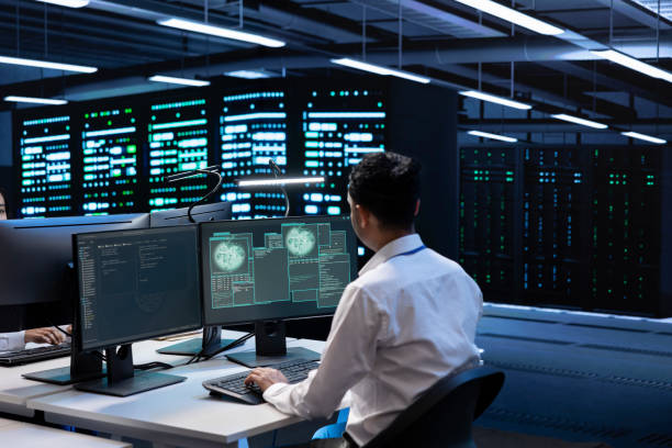 istock Employee inspecting data center equipment supporting worldwide network 2162387098