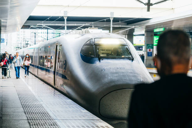 Passengers boarding a high-speed train at Beijing Railway Station on October 12, 2023, in Beijing, China.