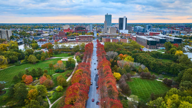 istock Aerial Autumn Cityscape with Tree-Lined Boulevard at Sunrise 2162389472